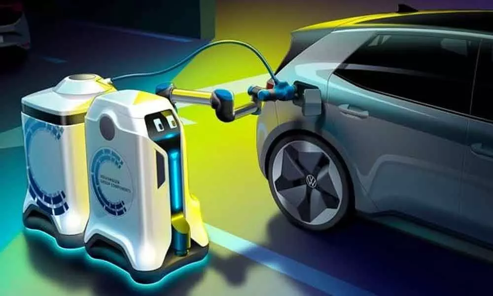 Volkswagen unveils visionary electric car-charging robot