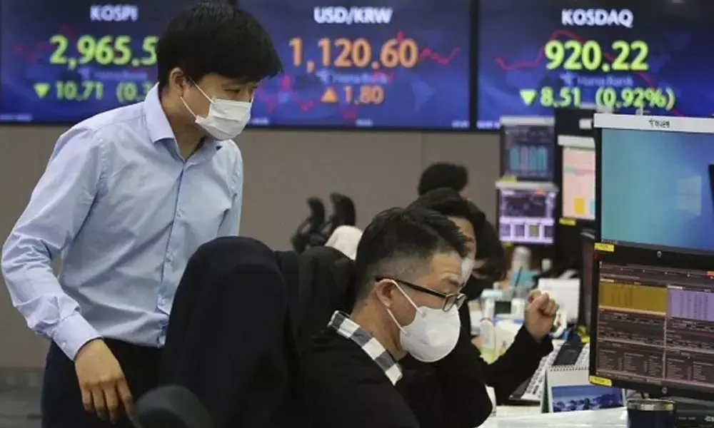 Asian shares wobble in volatile trade as China tech sell off weighs