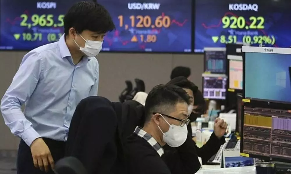 Asian shares wobble in volatile trade as China tech sell off weighs