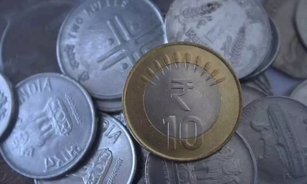 Rupee up 28 paise to close at 74.73 against Dollar