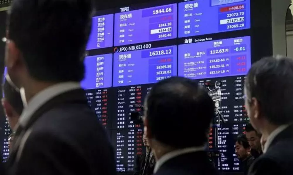 World stocks mixed as virus cases surge in Asia