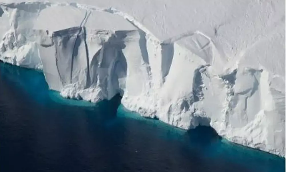 This occurs when the solid bedrock the West Antarctic Ice Sheet sits on rebounds upward as the ice melts and the total weight of the ice sheet decreases. The bedrock sits below sea level so when it lifts, it pushes water from the surrounding area into the ocean, adding to global sea level rise