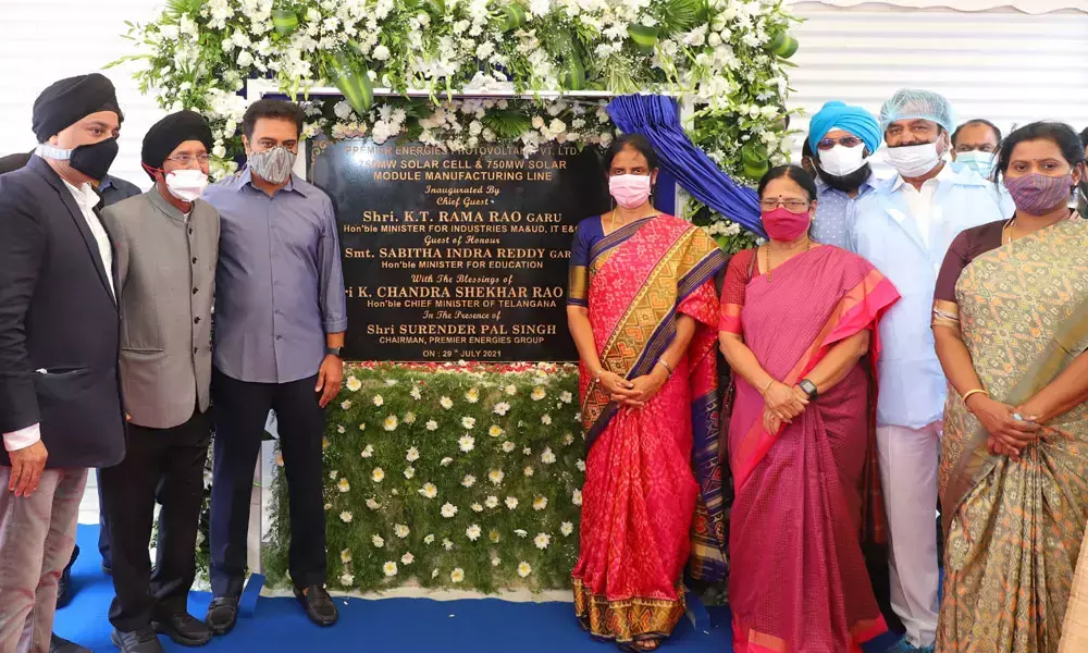 KT Rama Rao along with other dignitaries inaugurating Premier Energies’ new facility at E-City in Maheswaram mandal on Thursday in the presence of Chiranjeev Saluja (L)