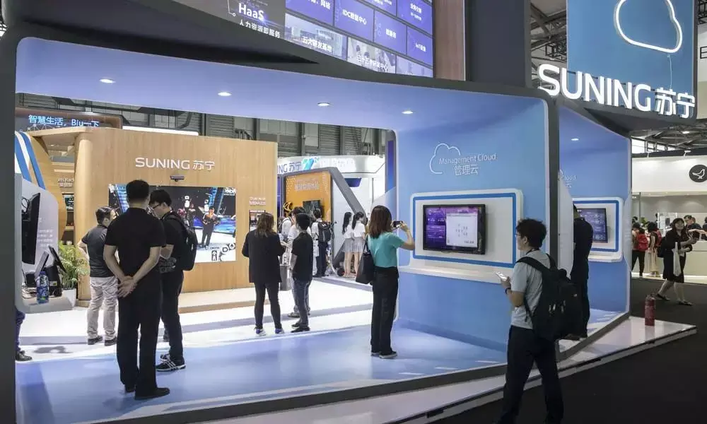 Chinese firms cashing out overseas bets to lock in gains