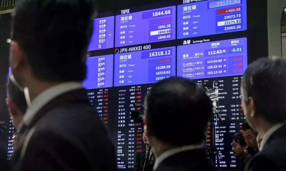 World stocks turn volatile as US Fed set for rate hike