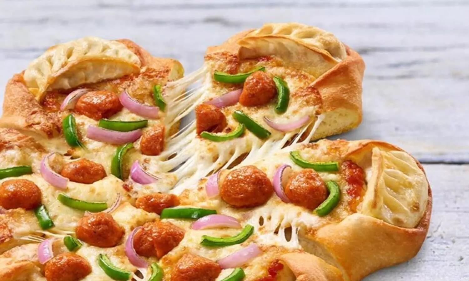 Pizza Hut bakes Momo Mia, a fusion of Pizza and Momos