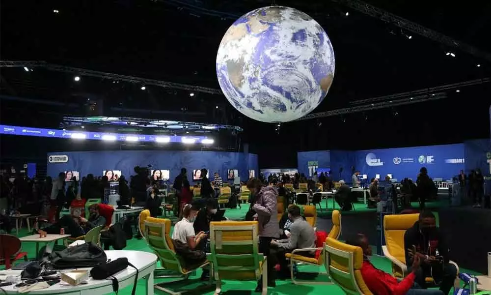Climate talks see bold promises, protests