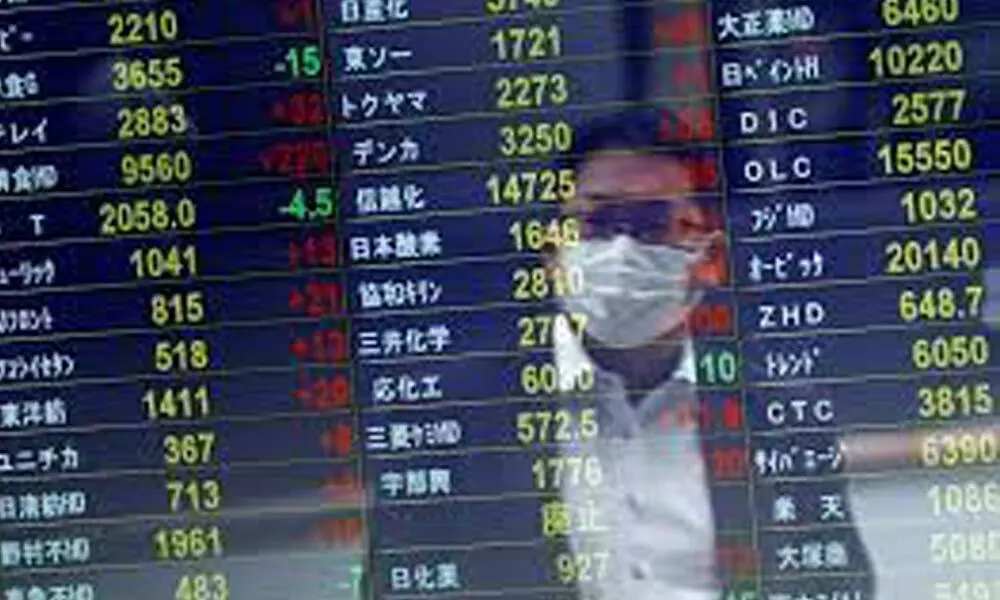 Asian shares slip despite Wall St gains after Biden-Xi talks