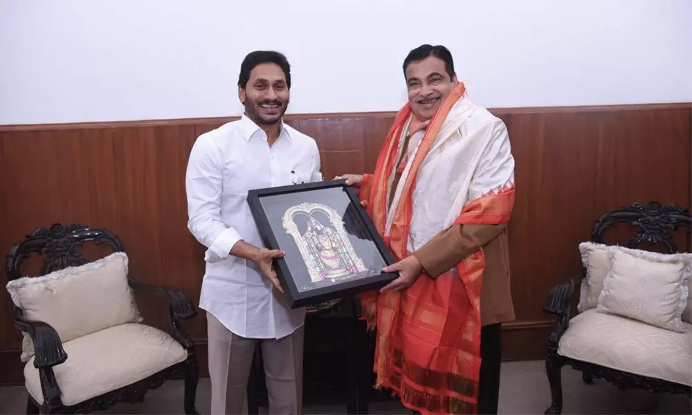 CM Y.S. Jagan Mohan Reddy presenting a memento to Union Minister Nitin Gadkari on Tuesday