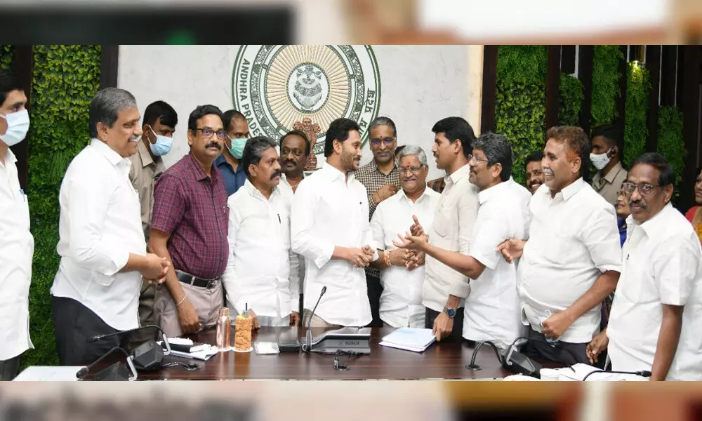 Employees union leaders thanking Chief Minister Y.S. Jagan Mohan Reddy after announcement of pay revision at Tadepalli near Vijayawada on Friday