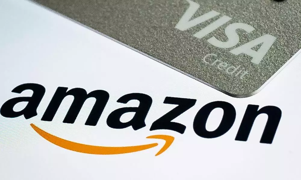Amazon, Visa to settle dispute over credit card fees