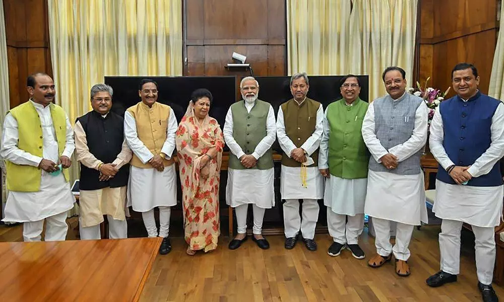 Prime Minister Narendra Modi with BJP MPs from Uttarakhand, Ajay Tamta, Ramesh Pokhriyal, Mala Rajya Laxmi Shah, Tirath Singh Rawat, Naresh Bansal, Ajay Bhatt, and Anil Baluni, and BJP National General Secretary Dushyant Gautam, during their meeting after BJP’s victory in recent Uttarakhand Assembly elections, in New Delhi