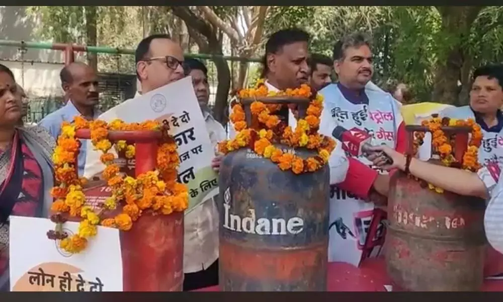 Protest against steep rise in prices of petrol, diesel & gas