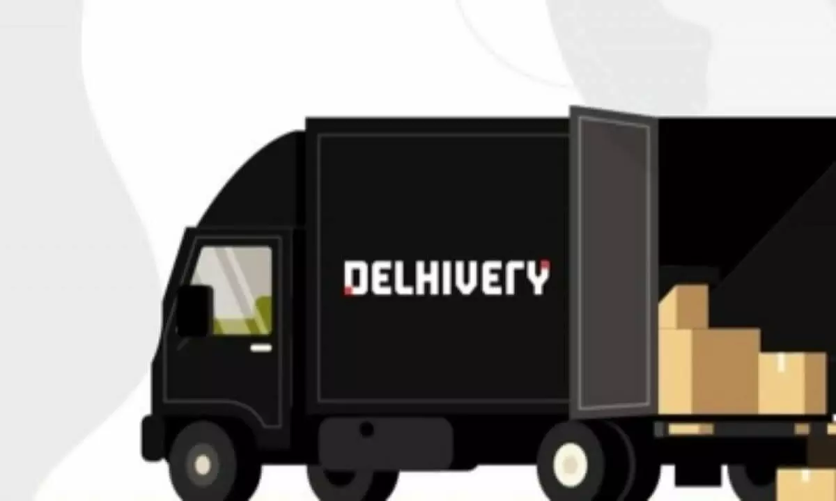 Delhivery lists with mild premium, surges sharply later