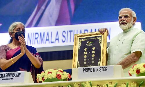 PM bats for global role to Indian rupee