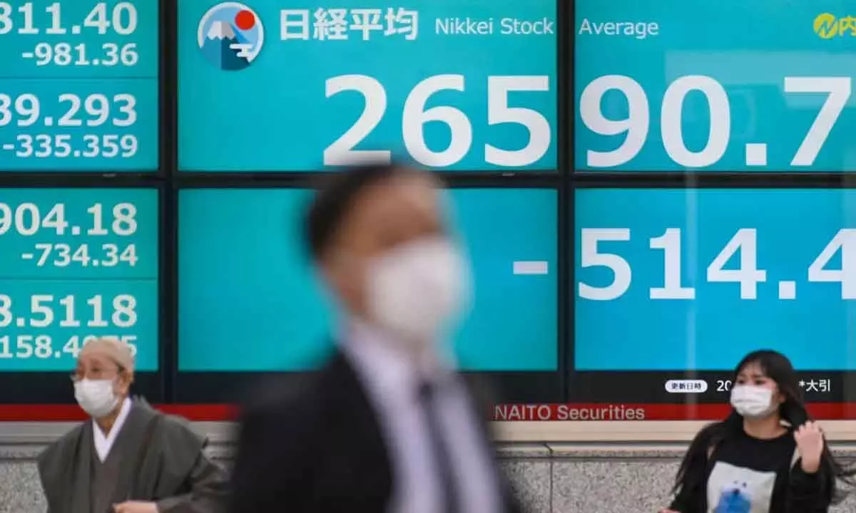 Asian stocks turn volatile amid US slowdown fears