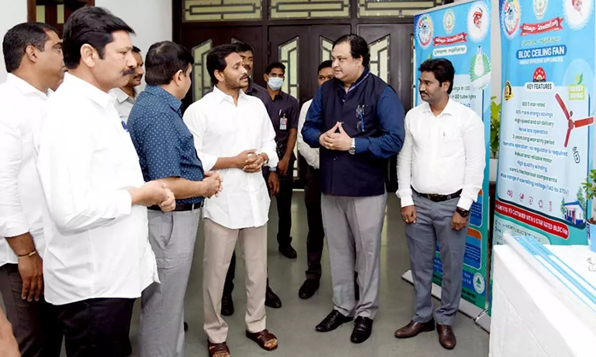 Officials explaining on quality of material used for building Jagananna Houses before a review meeting at Tadepalli on Monday