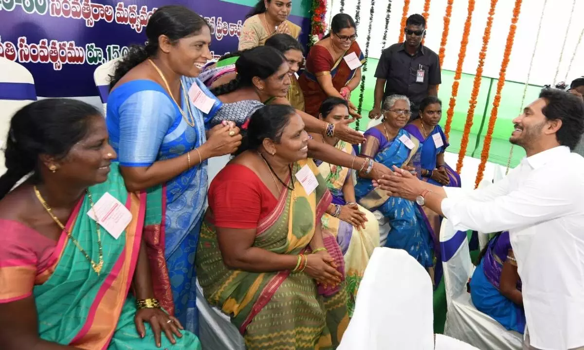 Chief Minister Y.S. Jagan Mohan Reddy acknowledging greetings from beneficiaries at a programme near Kakinada