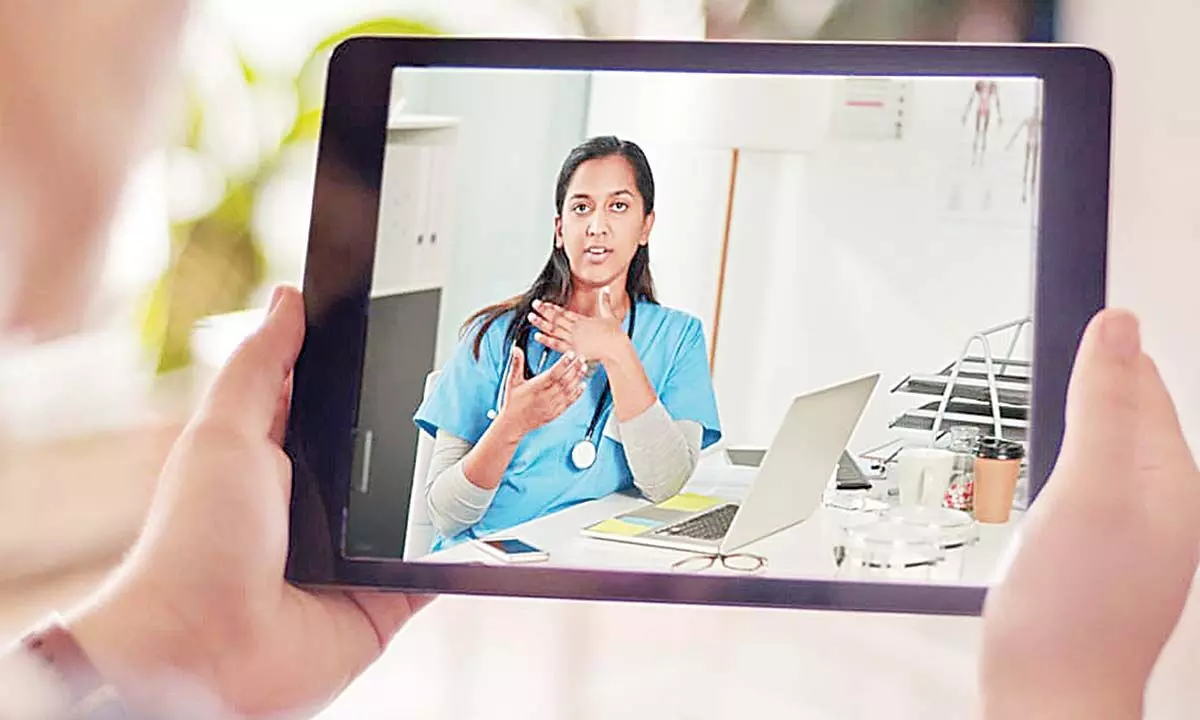 A photo of a person on a virtual medical appointment on a tablet 