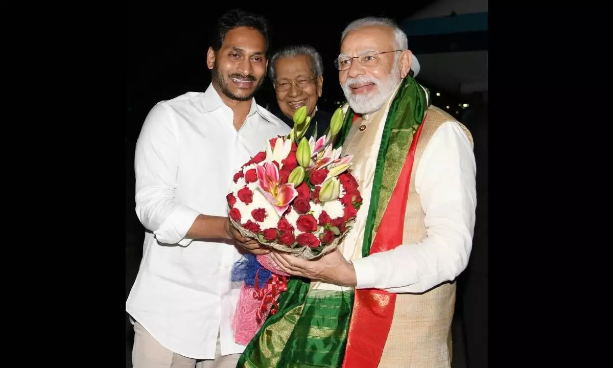Prime Minister Narendra Modi being greeted by Chief Minister Y.S. Jagan Mohan Reddy on arrival in Visakhapatnam on Friday evening