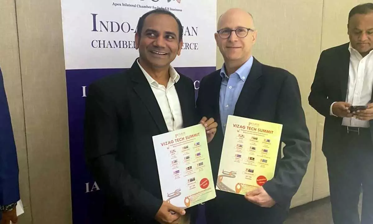 (From left) Dr Srinubabu CEO, Pulsus Group and M Jonathan Heimer, Minister Counselor for Commercial Affairs, United States Embassy, New Delhi holding the Vizag Tech Summit poster