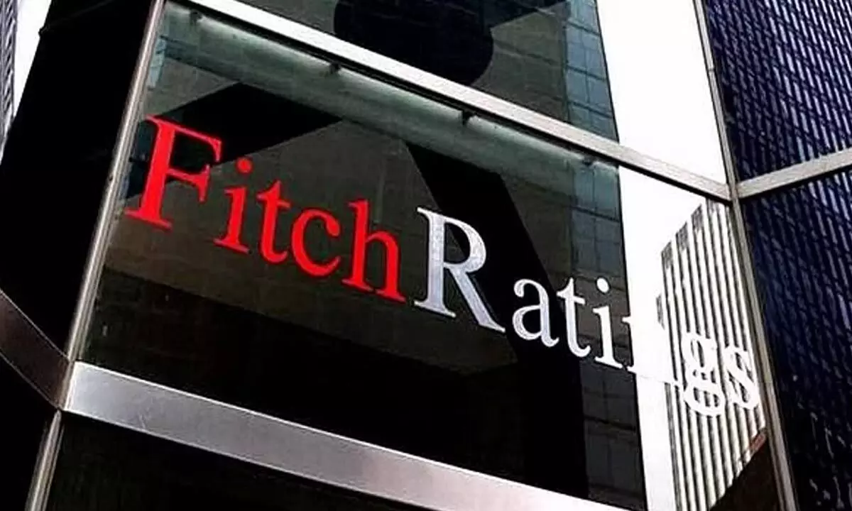 Fitch trims US rating