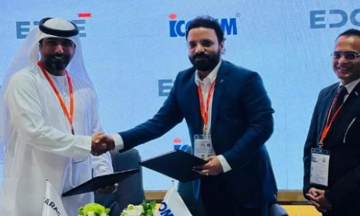 Caracal CEO Hamad Al Ameri and ICOMM MD Sumanth P exchanging the licensing agreement documents