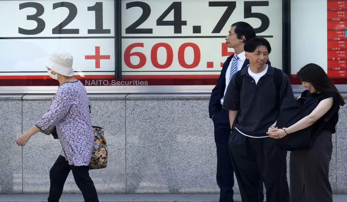 Asian indices track gains on Wall St up amid strong US jobs data