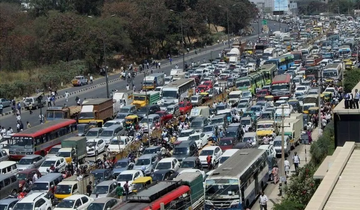 Bengaluru traffic inspires multitasking feats! Biker attends meeting amidst traffic jam