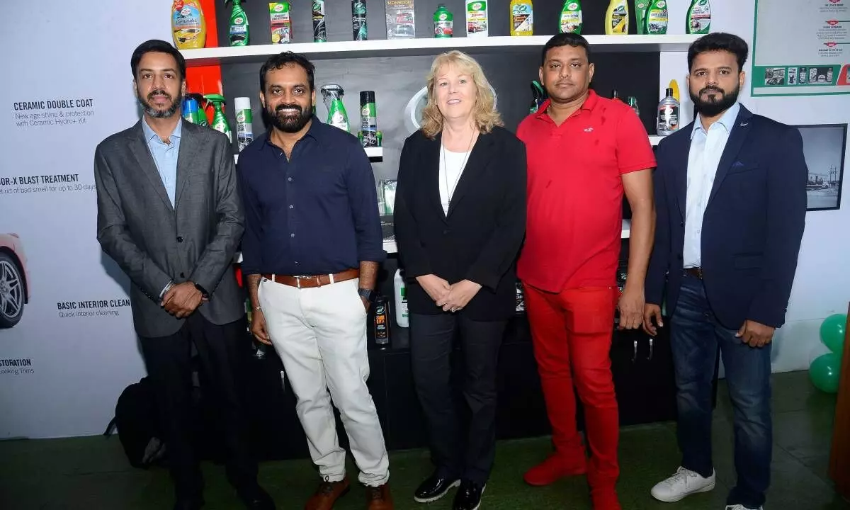 Laurie King (C), COO, Turtle Wax Global with other members during the opening of car care studio in Hyderabad on Wednesday
