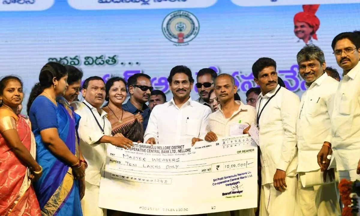 AP CM Y S Jagan Mohan Reddy releasing financial assistance for handloom weaver families, at Venkatagiri on Friday