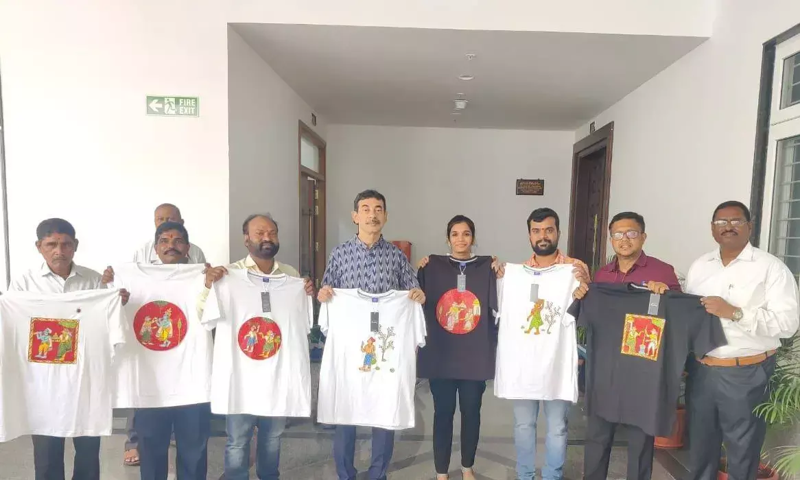 Telangana IT Principal Secretary Jayesh Ranjan (C) launching the hand-painted Cheriyal T- Shirts in Hyderabad on Monday