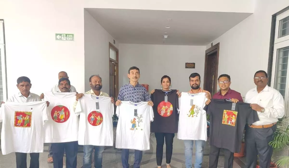 Telangana IT Principal Secretary Jayesh Ranjan (C) launching the hand-painted Cheriyal T- Shirts in Hyderabad on Monday Telangana IT Principal Secretary Jayesh Ranjan (C) launching the hand-painted Cheriyal T- Shirts in Hyderabad on Monday