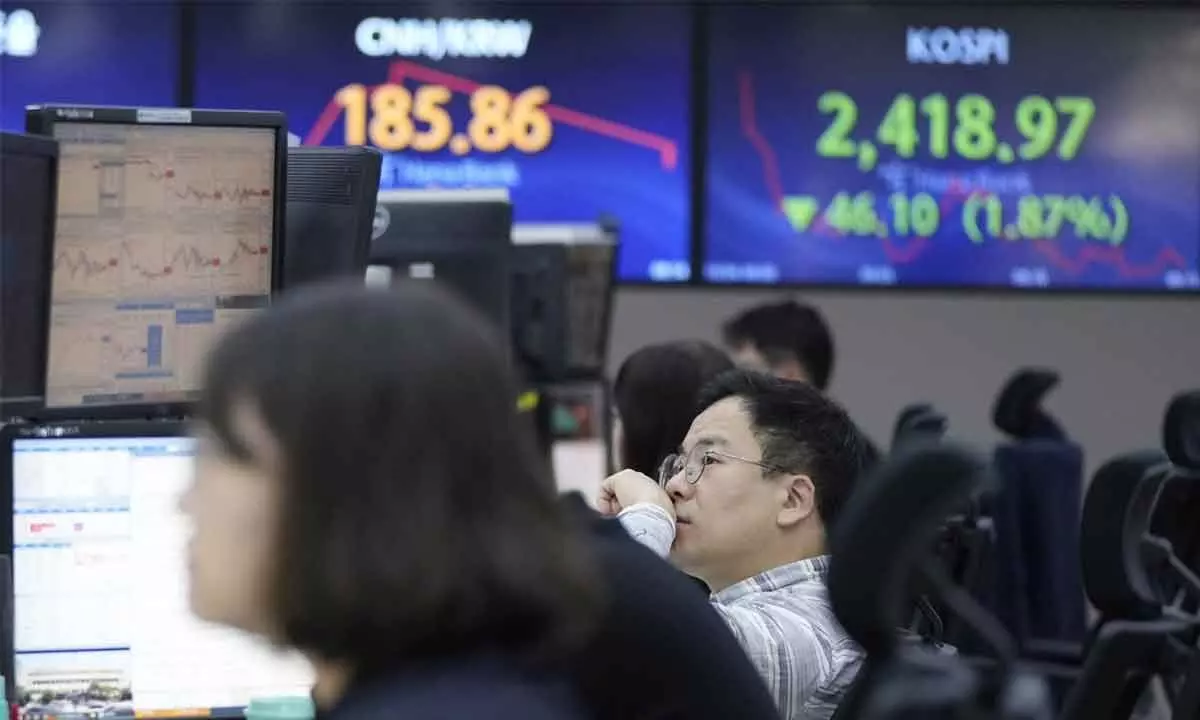 Asian indices turn sluggish tracking rates-driven tumble on Wall Street