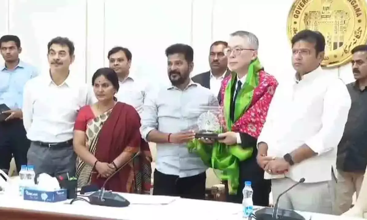 Telangana Chief Minister A Revanth Reddy felicitating Foxconn’s Hon Hai Precision Industry Company Ltd representative,  V Lee at the State Secretariat on tuesday