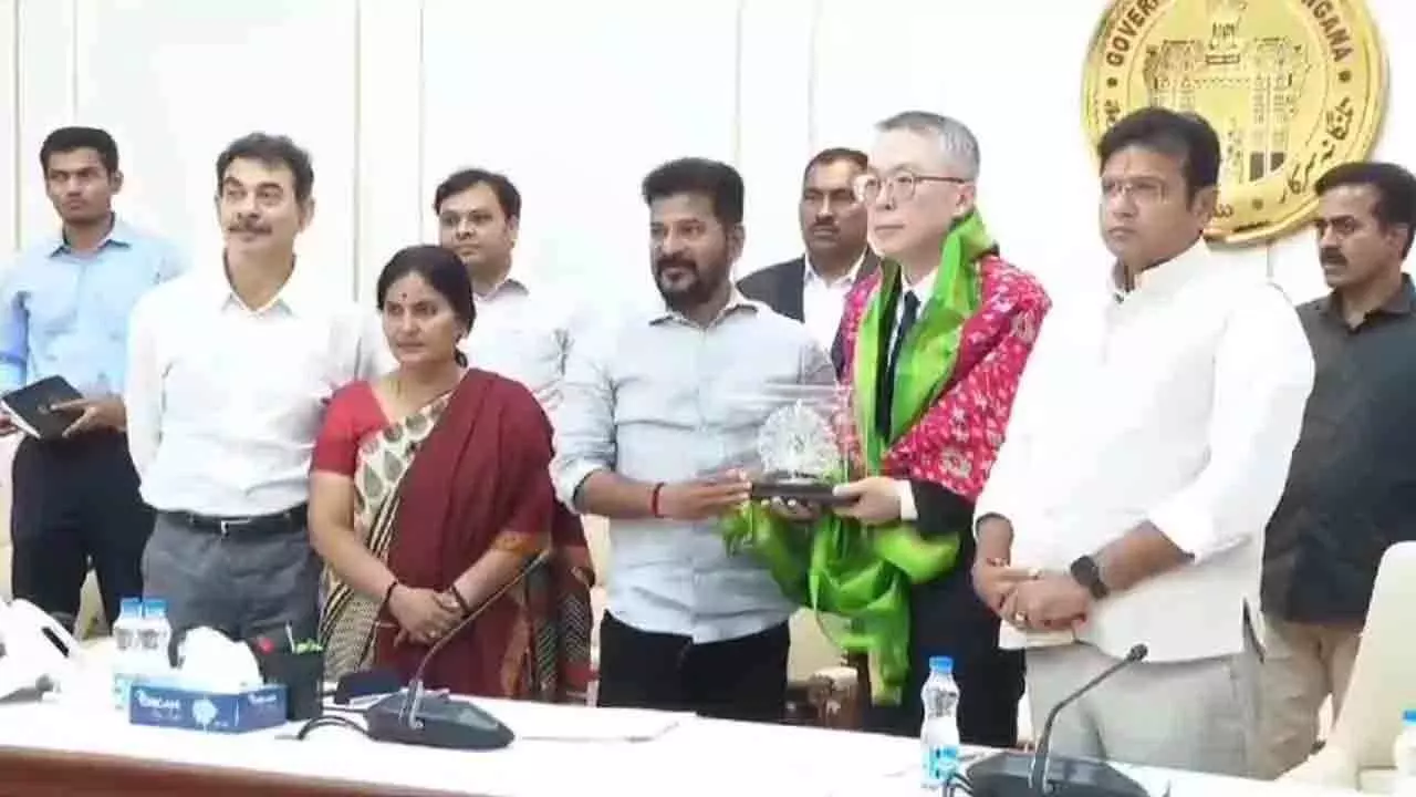 Telangana Chief Minister A Revanth Reddy felicitating Foxconn’s Hon Hai Precision Industry Company Ltd representative,  V Lee at the State Secretariat on tuesday