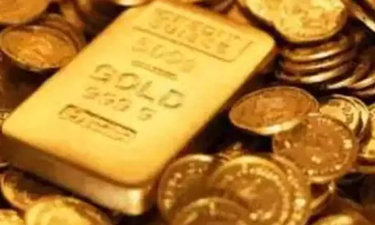 Gold futures fall on low demand
