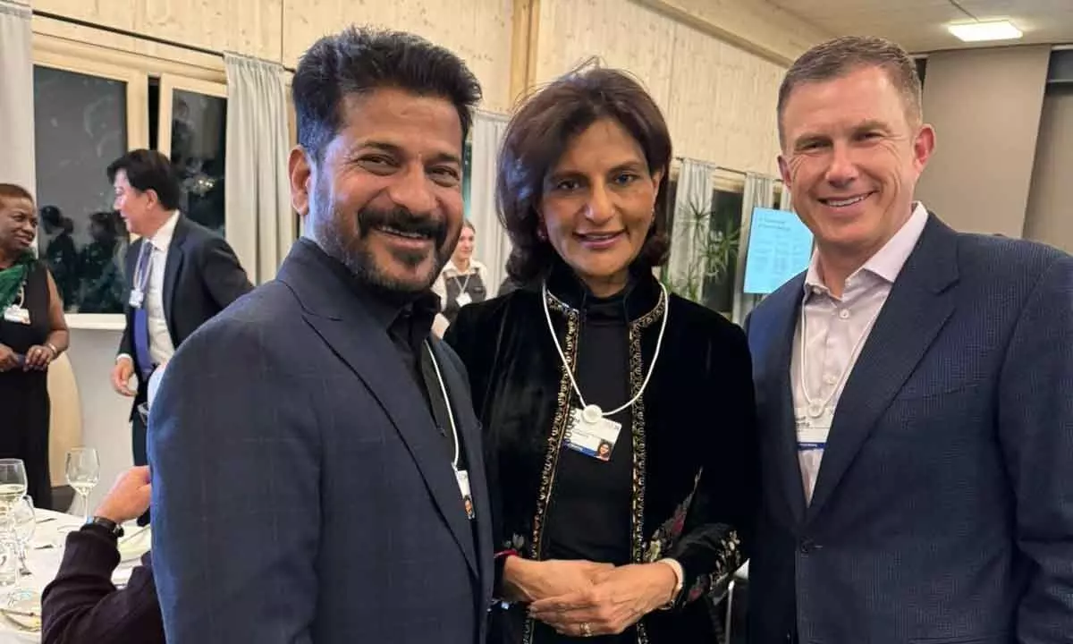 Telangana Chief Minister Revanth Reddy with Geoff Martha, CEO of Medtronic, and Preetha Reddy from Apollo Hospital discussing plans for the fusion of healthcare and technology in the state