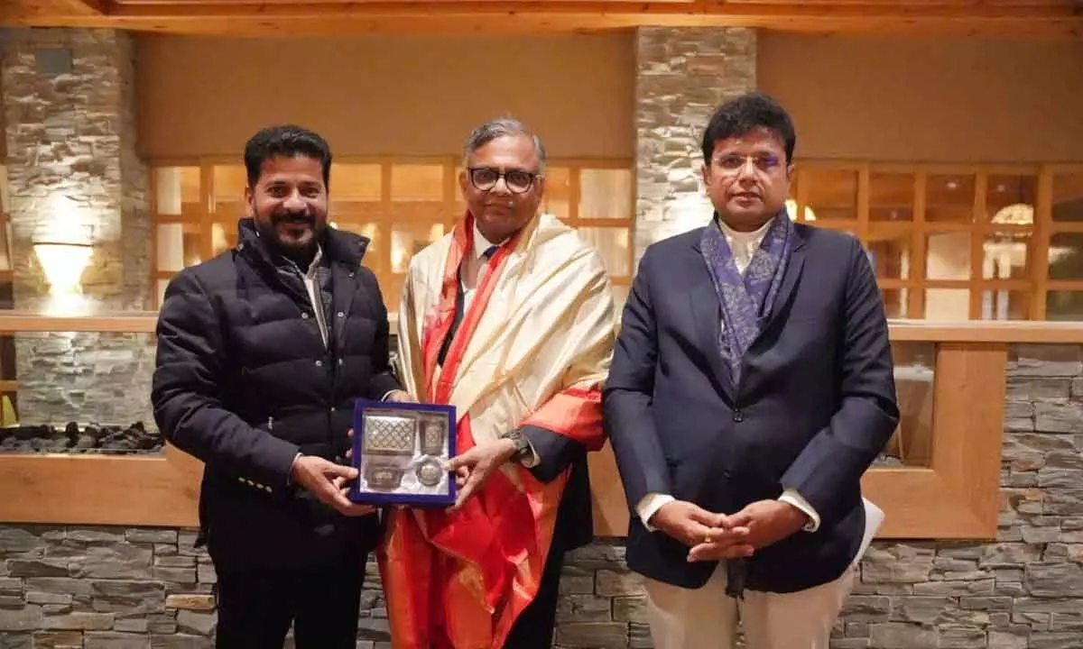 Telangana Chief Minister Anumula Revanth Reddy felicitating Tata Group Chairman N Chandrasekaran at World Economic Forum (WEF), Davos. Telangana IT and Industries Minister D Sridhar Babu is also seen