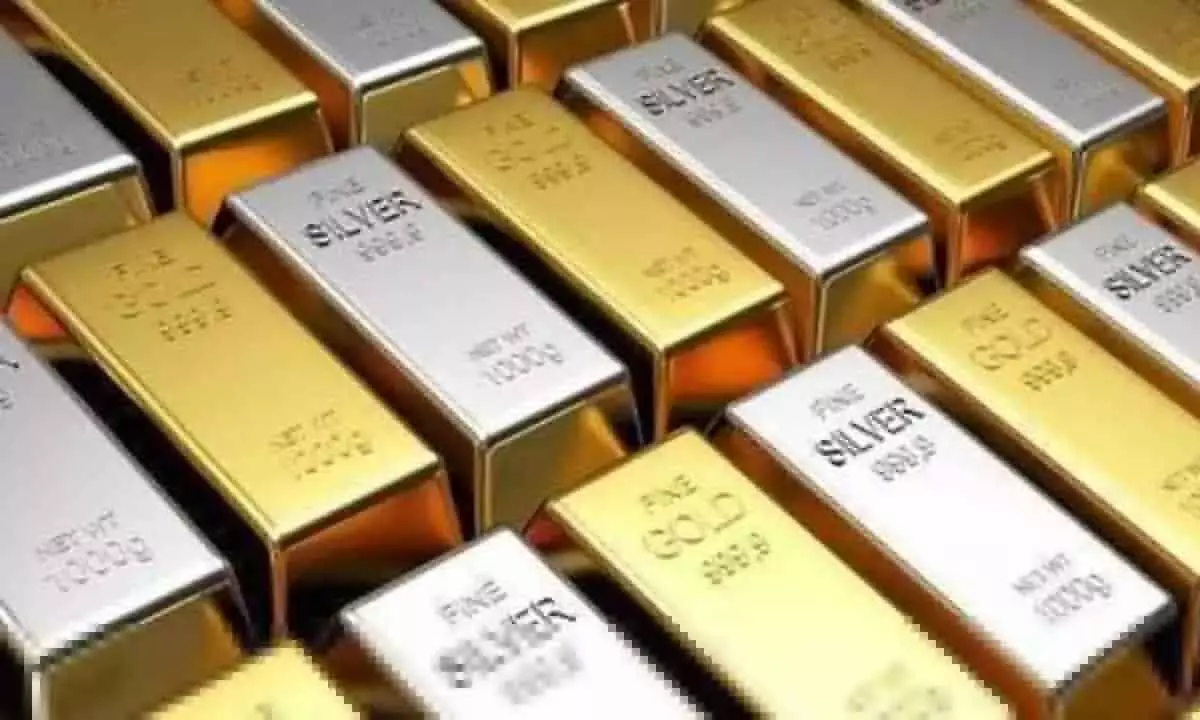 Gold futures rise on spot demand