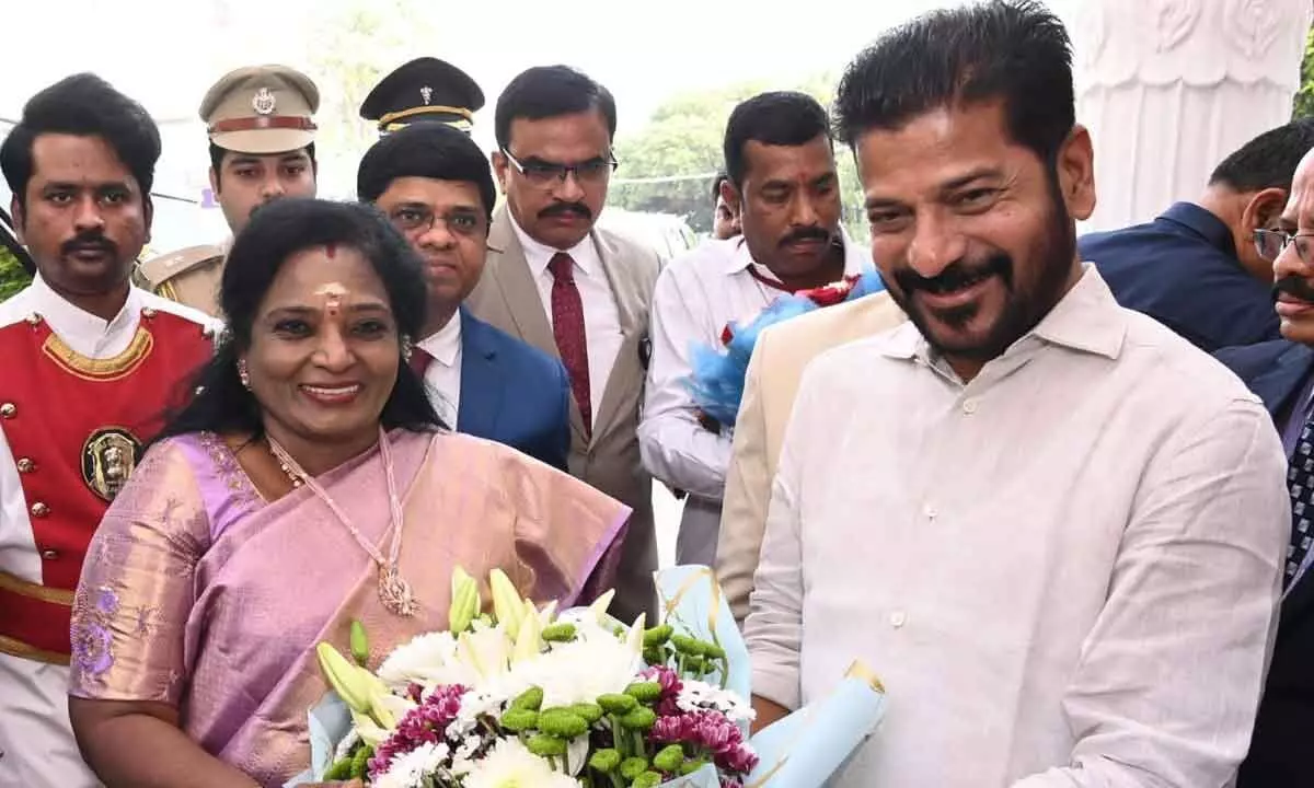 Telangana Governor Tamilisai Soundararajan being welcomed by Chief Minister A Revant Reddy on the first day of the Budget session in Hyderabad on Thursday