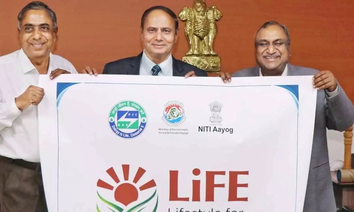 CIC Heeralal Samariya(C) along with Shashank Goel, Director General, Dr MCR HRD Institute, A Chandra Sekhara Reddy(L), Media Advisor, (Southern States/ UTs), BEE, GOI unveiling a poster on Mission LIFE in Hyderabad