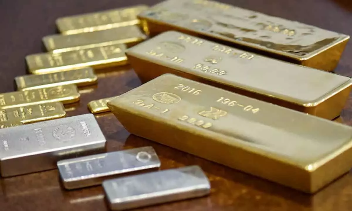 Gold falls Rs 50; silver climbs Rs 100