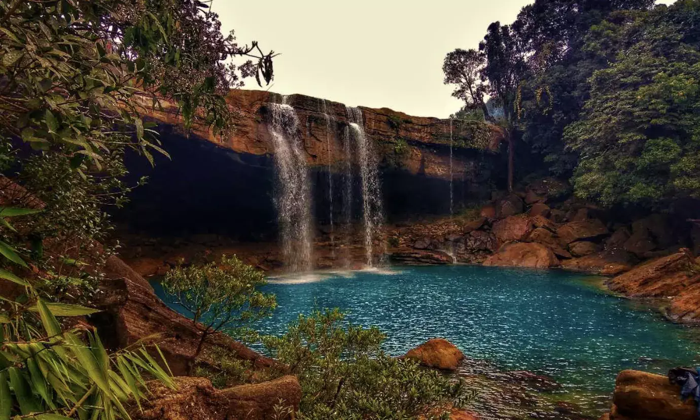 Unwind at Krang Suri waterfalls with charming local Khasi cuisine!