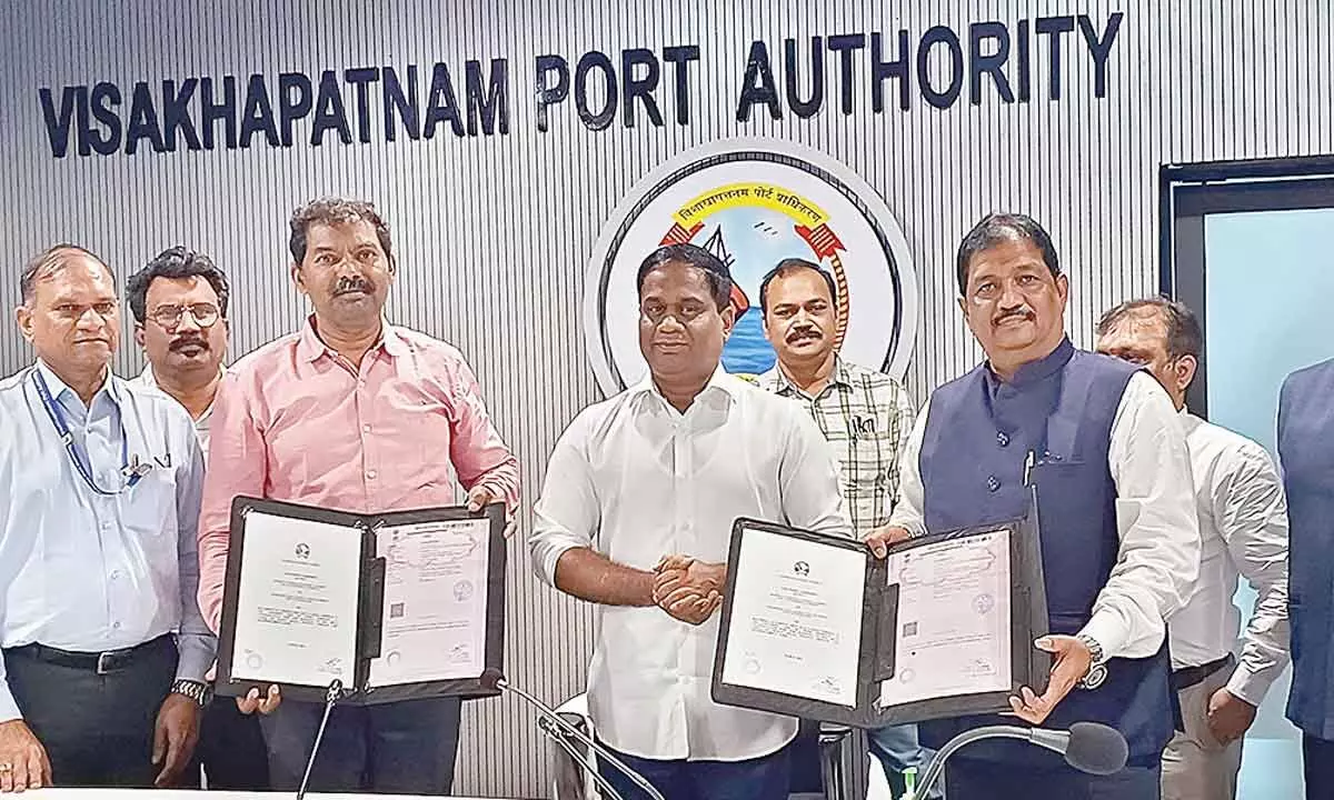 Visakhapatnaman Port Chairman M Angamuthu exchanging concession agreement for upgrading West Quay-6 Terminal with OSL Group on Tuesday