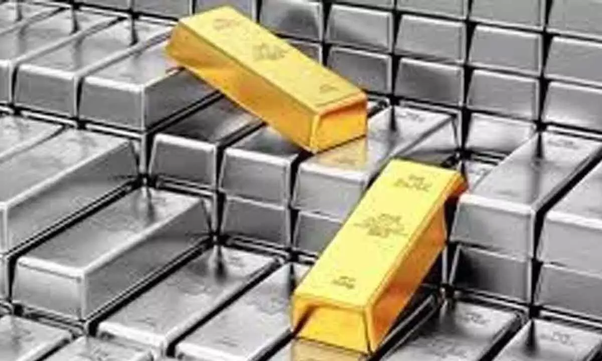 Gold futures rise on spot demand