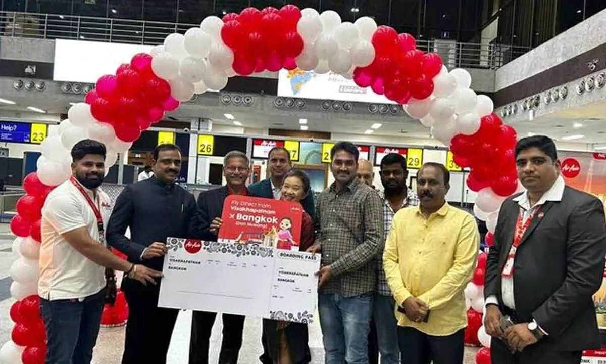 First passenger for inaugural flight to Bangkok being welcomed by officials of AirAsia and travellers’ associations at the  Visakhapatnam International Airport