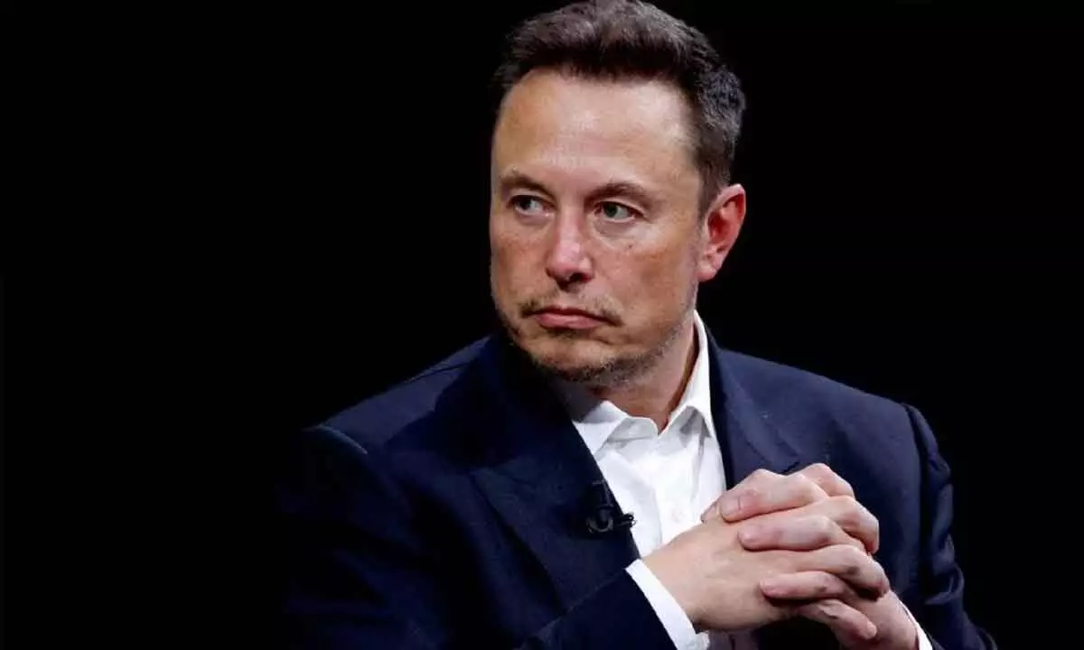 It is time to reorganise Tesla, says Musk as company logs slow growth
