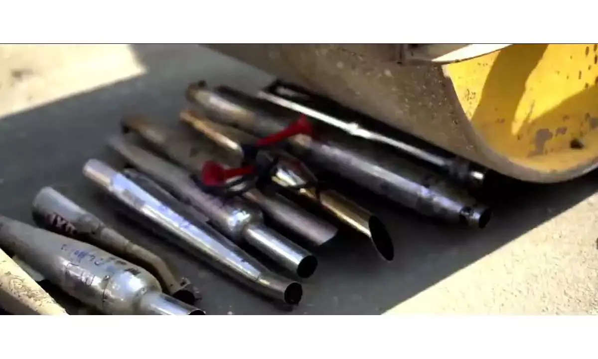silencers Of 53 Noise-Polluting 2-Wheelers Trampled With Road Roller!