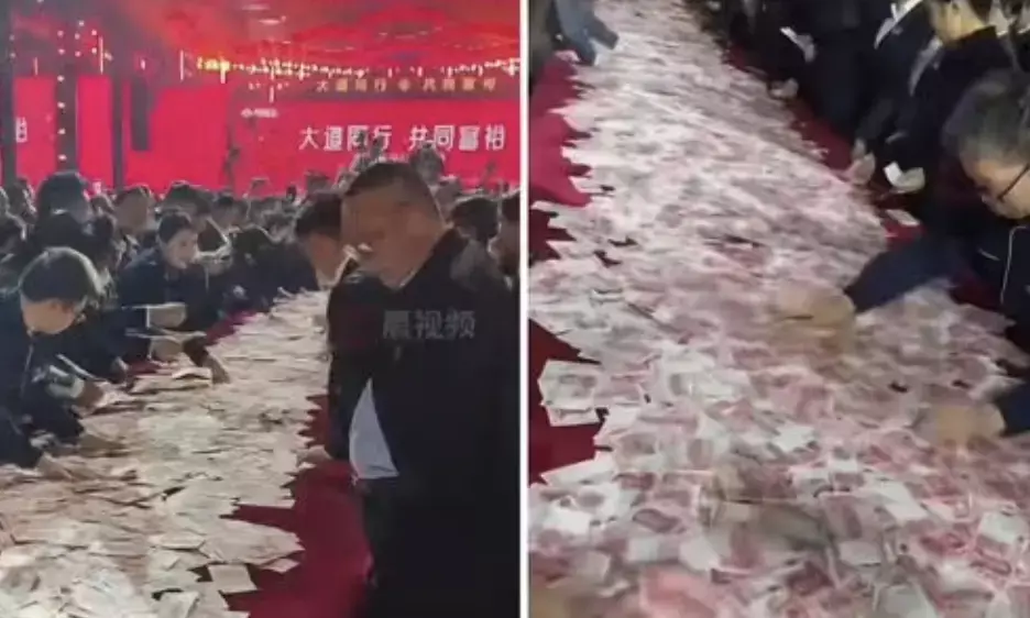 Chinese company stuns employees with bumper bonus of Rs. 80 crore in Cash on the Table!